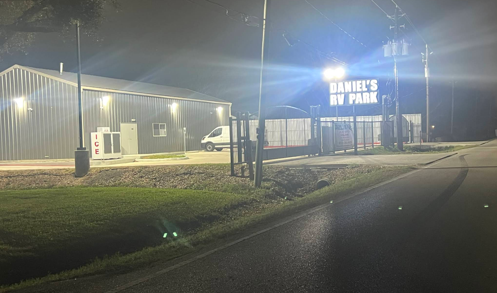 Illuminated Daniel’s RV Park entrance sign at night